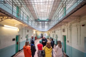 A Tour Guide talks to his group at Shepton Mallet Prison