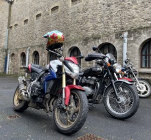 An image showcasing three of the prestigious MAG Motorcycles from their memorial ride at Shepton Mallet Prison.