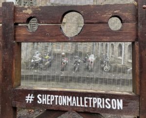 A view captured through the stocks at Shepton Mallet Prison of the prestigious MAG Motorcycles. 