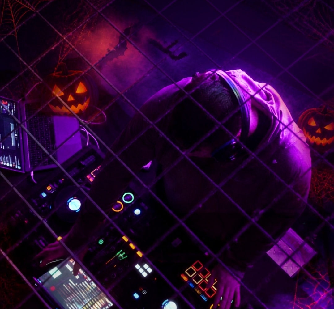 DJ in a historic wing of Shepton Mallet Prison during the Halloween Silent Disco event