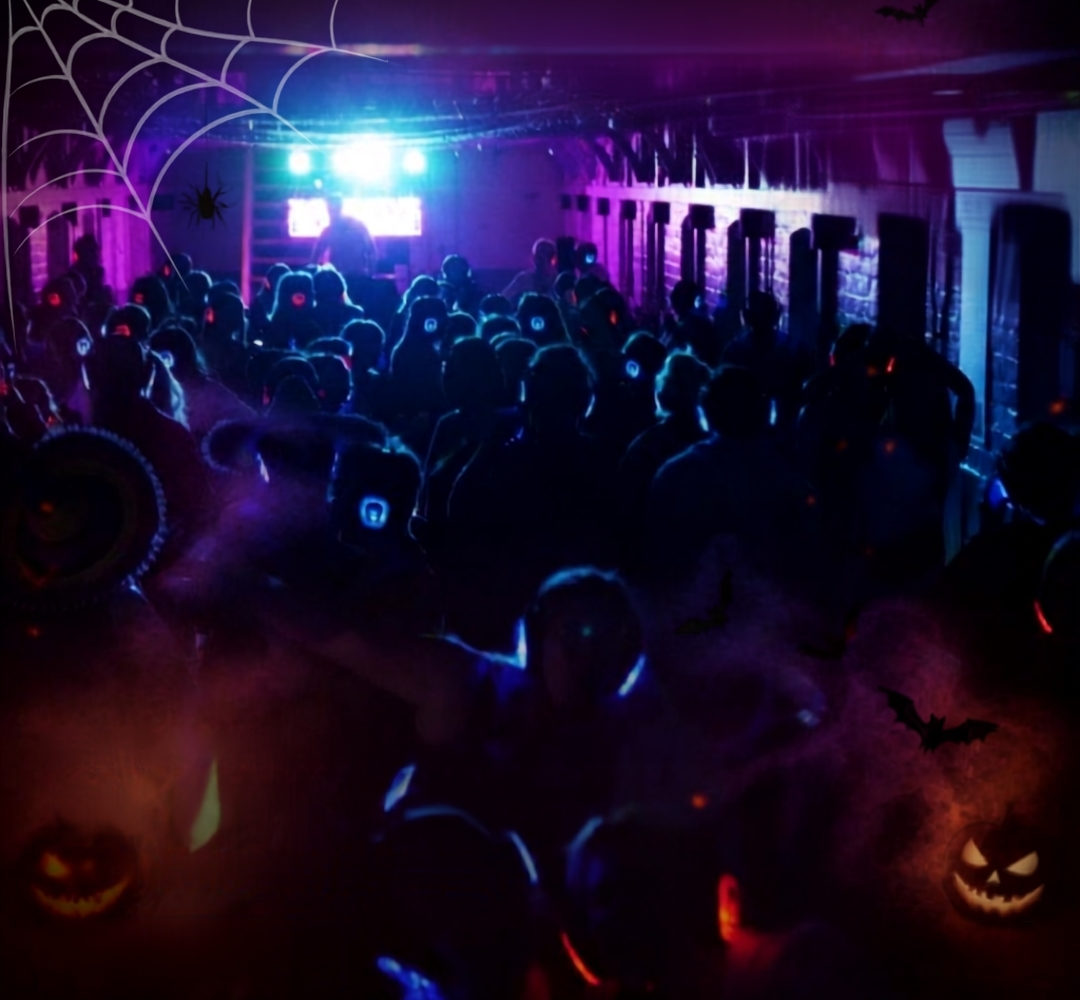 Silent Disco guests dancing beneath Shepton Mallet Prison landings on Halloween