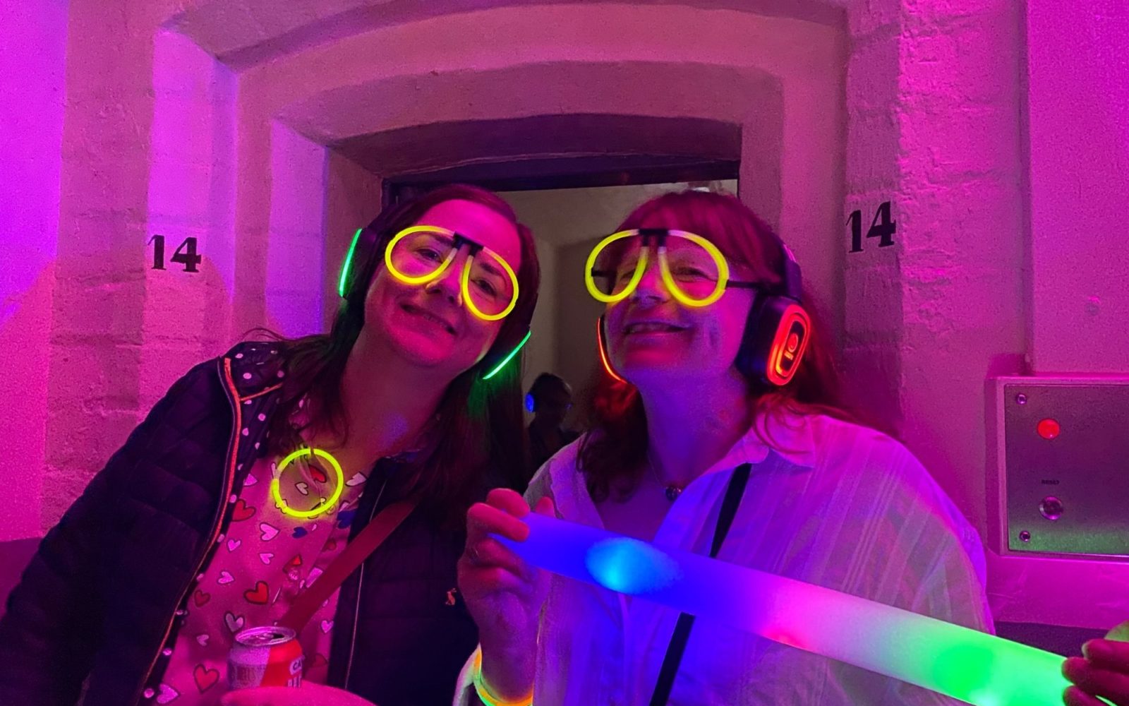 Silent Disco guests having fun in front of cell at Shepton Mallet Prison on Halloween
